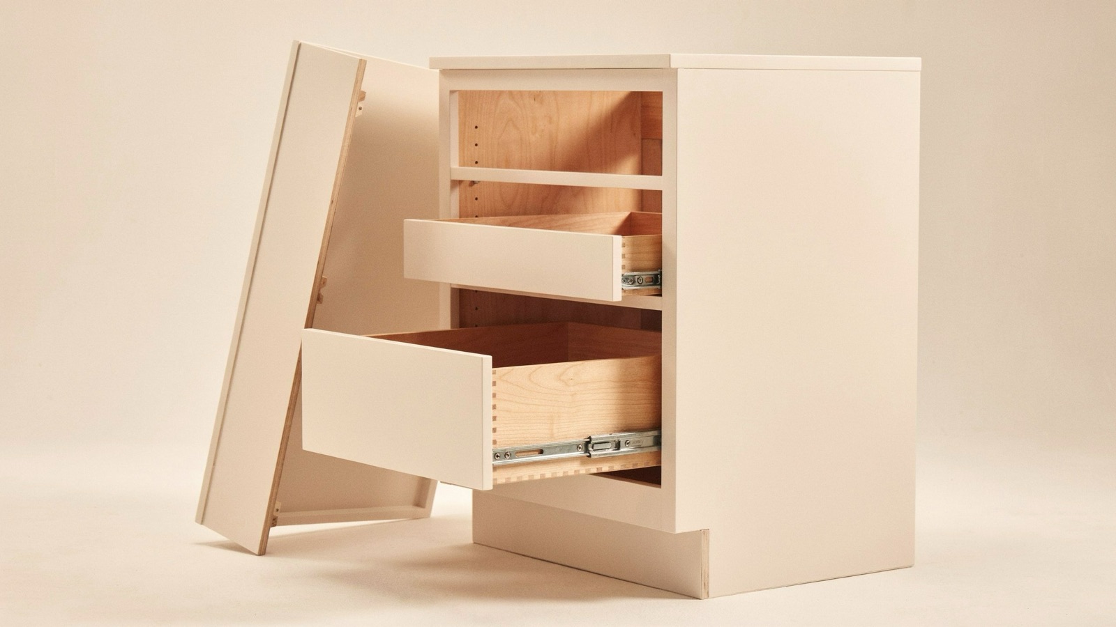 Copper Canyon cabinet with door open and drawers extended, showing dovetail joinery and soft-close slides